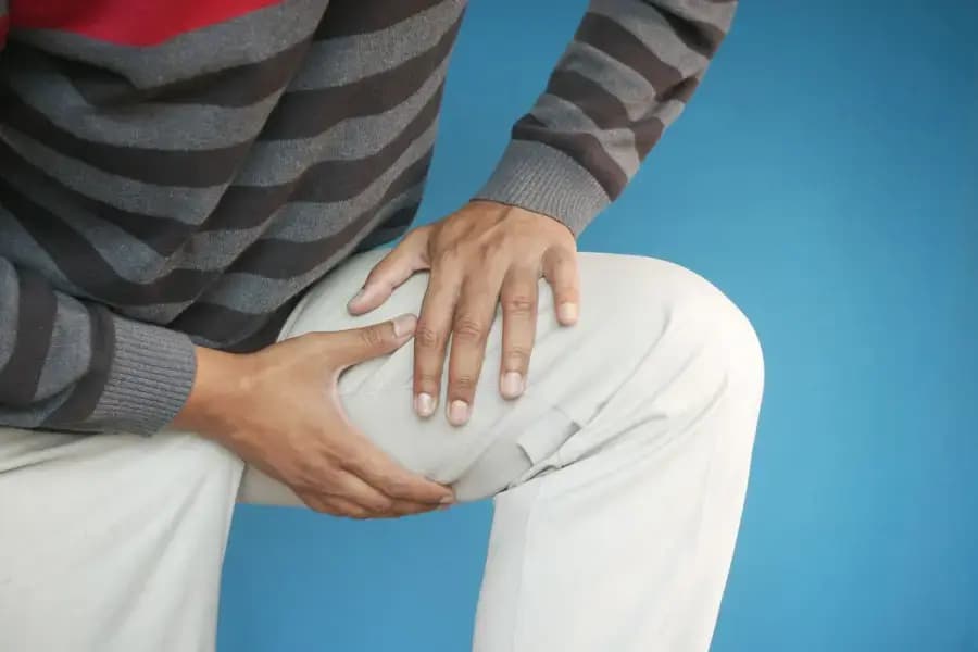 ACL reconstruction rehabilitation physiotherapy Bangalore — knee anatomy showing anterior cruciate ligament injury and 24-week return-to-sport rehab protocol at Pro Physiotherapy JP Nagar 8th Phase