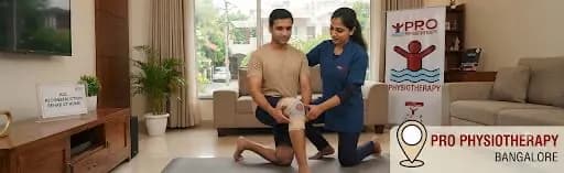 ACL Reconstruction Rehab at Home in Bangalore | 24-Week Return-to-Sport | Pro Physiotherapy JP Nagar ACL reconstruction rehab at home in Bangalore — Pro Physiotherapy JP Nagar female MPT physiotherapist guiding a young male patient through single-leg squat, closed-chain quadriceps activation, at-home ACL post-surgical protocol